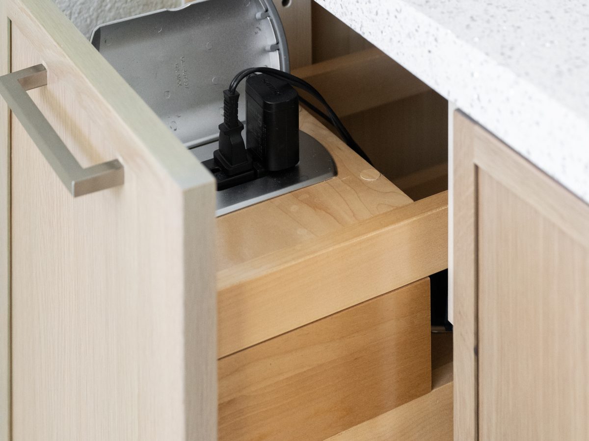 bathroom drawer with built-in power strip and concealed charging station — Reveal Interior Design Las Vegas
