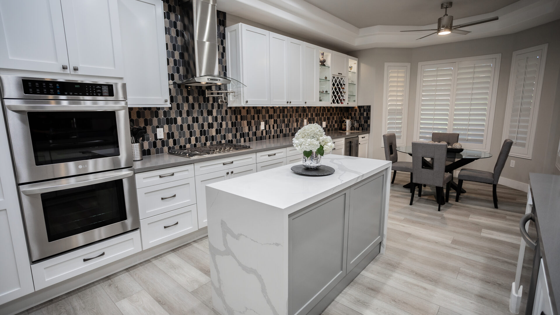 Contemporary waterfall island kitchen design Las Vegas — Reveal Interior Design